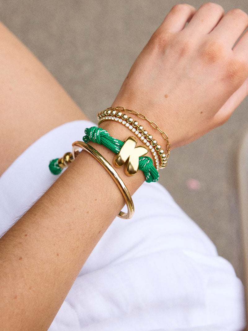 BaubleBar Green Apple - 
    Gold initial waterproof paracord bracelet
  
