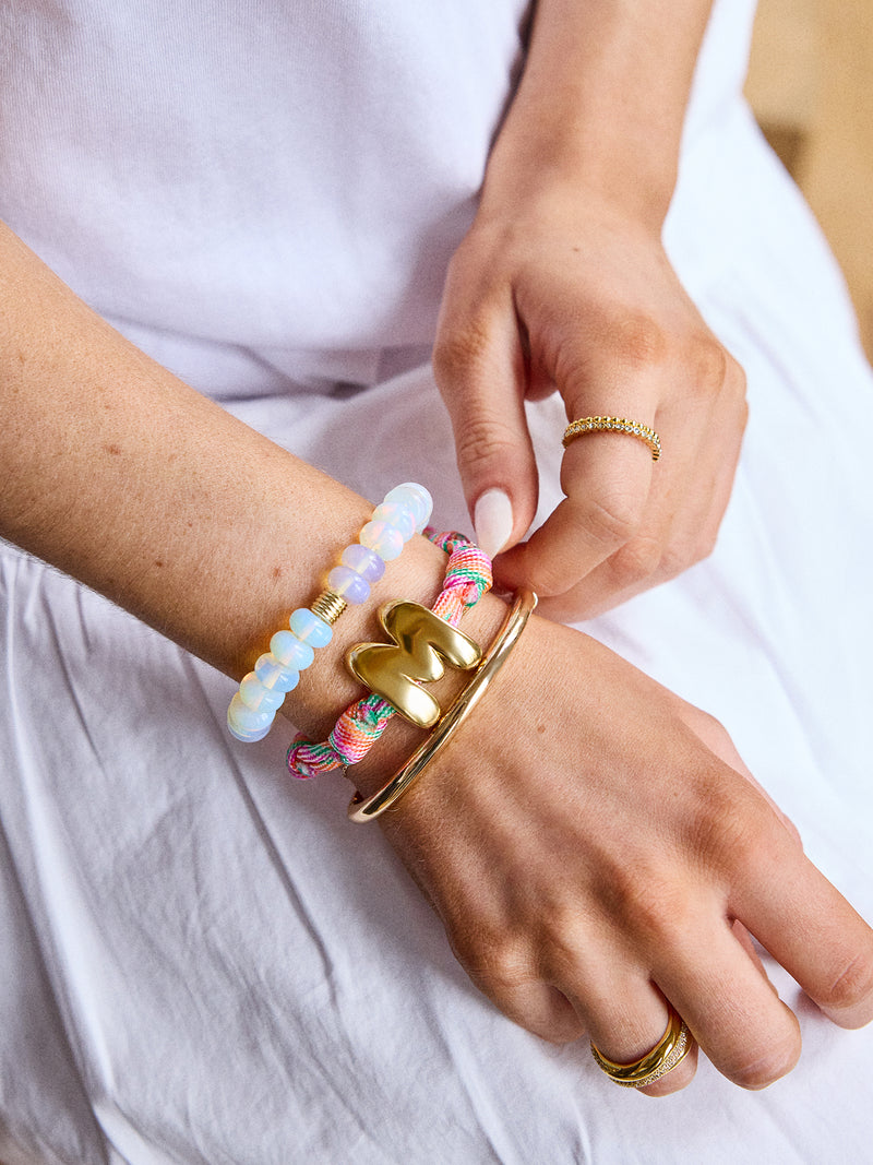 BaubleBar Pink Strawberry - 
    Gold initial waterproof paracord bracelet
  
