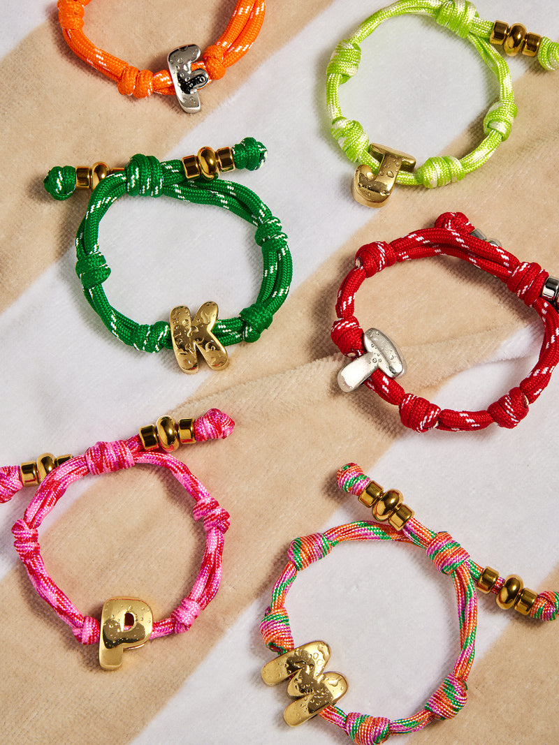 BaubleBar Red Cherry - 
    Gold initial waterproof paracord bracelet
  
