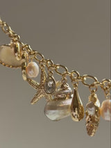BaubleBar Isla Charm Bracelet - Gold/Pearl - 
    Shell and pearl charm bracelet
  
